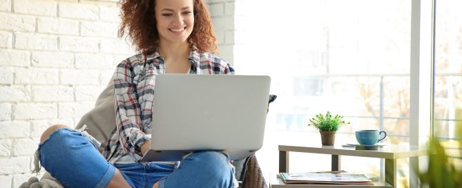 Woman signing into Patient Portal.